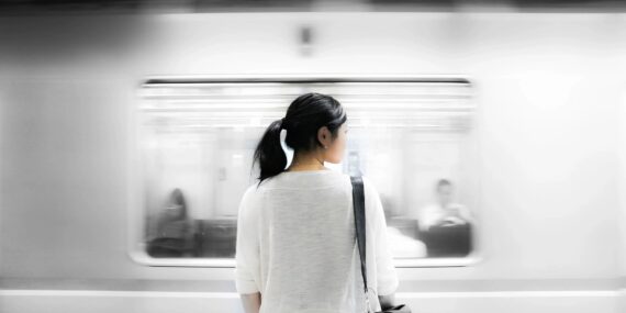 Woman looking at subway train